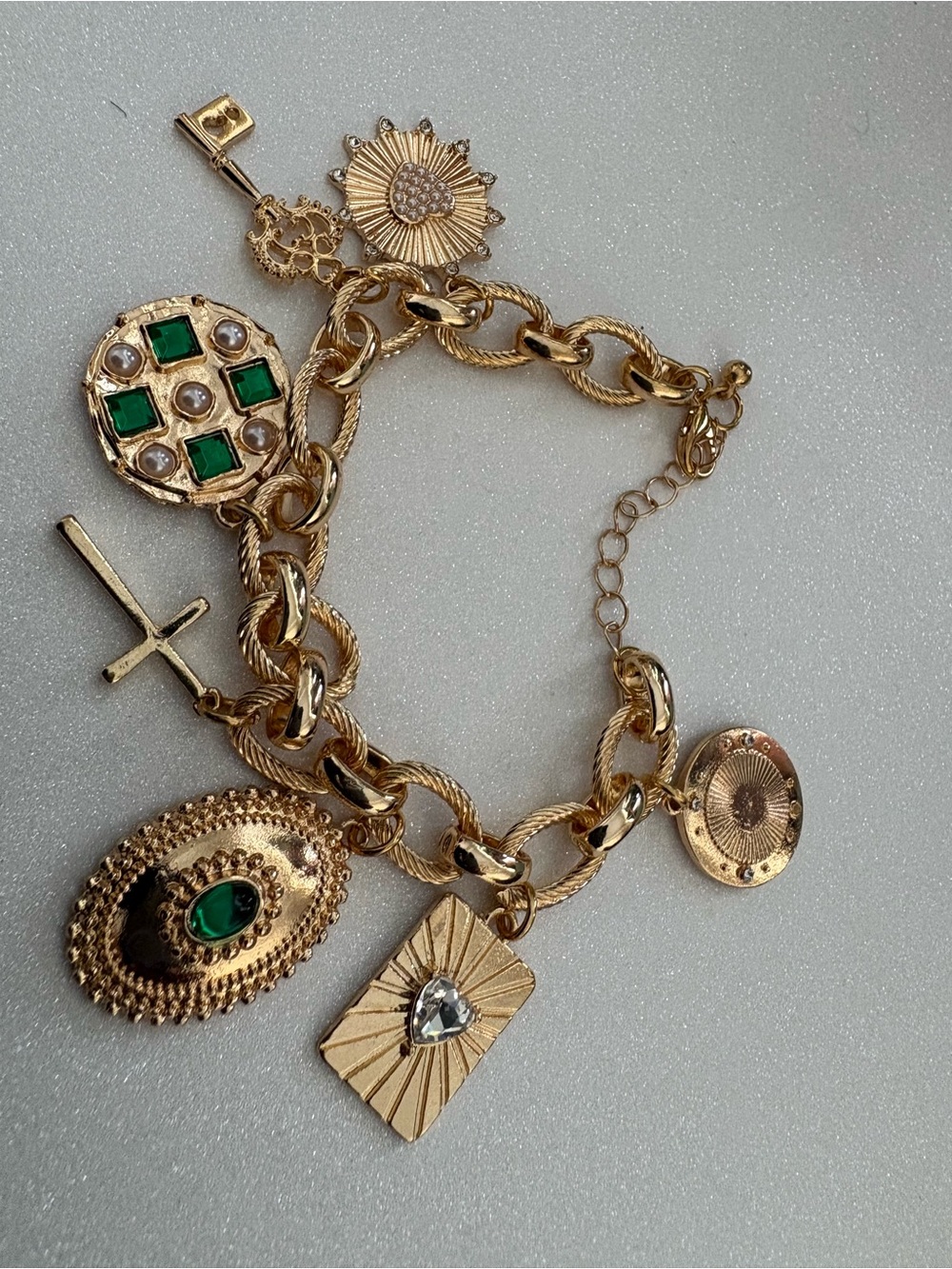 Gold Charm Bracelet with Emerald Green Accents